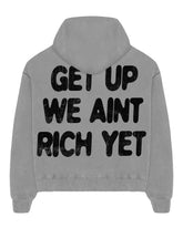 Get Up We Ain’t Rich Yet motivational streetwear hoodie back view in gray color.
